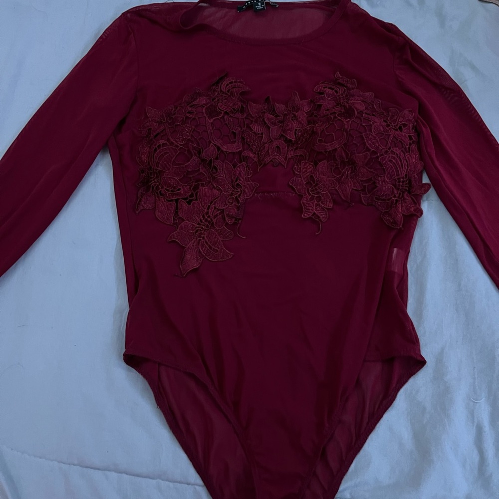 Used seemless body suit burgundy with floral bra